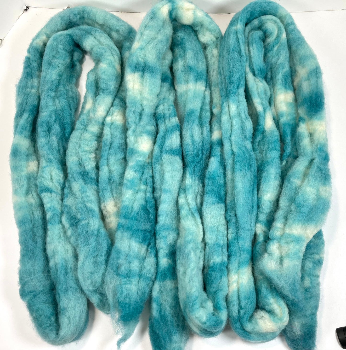 Soft Aqua Oopsie - 2 oz Bluefaced Leicester wool combed top, roving, spinning fiber, handspinning, felting, needle felting, weaving supplies